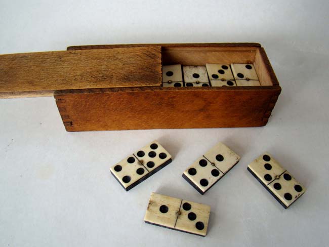 A boxed set of Civil War era bone and ebony dominoes circa 1860-1870